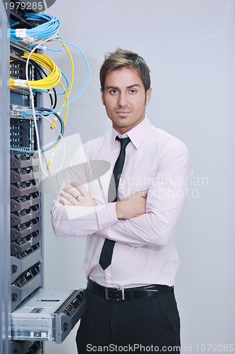 Image of young it engineer in datacenter server room