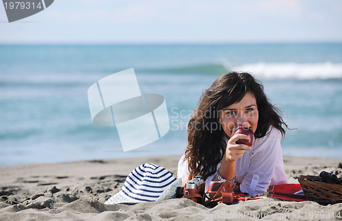 Image of happy young woman on beach