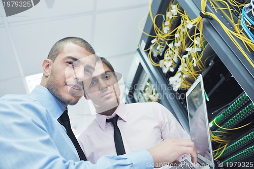 Image of it engineers in network server room