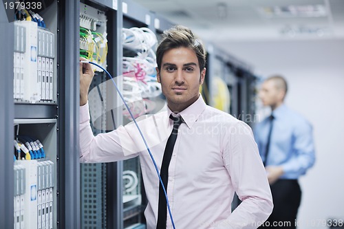 Image of it enineers in network server room