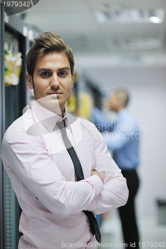 Image of it engineers in network server room