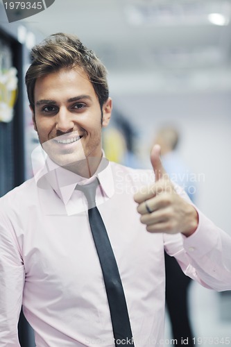 Image of it engineers in network server room