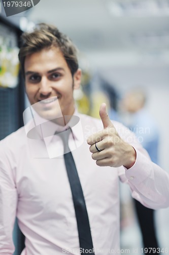 Image of it engineers in network server room