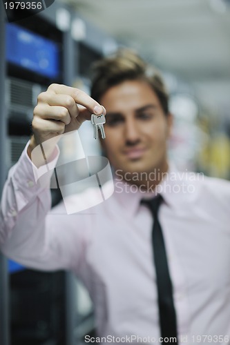 Image of young it engineer in datacenter server room