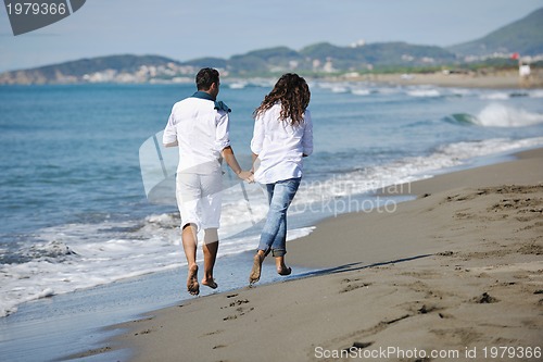 Image of happy young couple have fun at beautiful beach