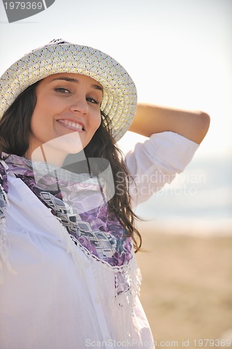 Image of happy young woman on beach