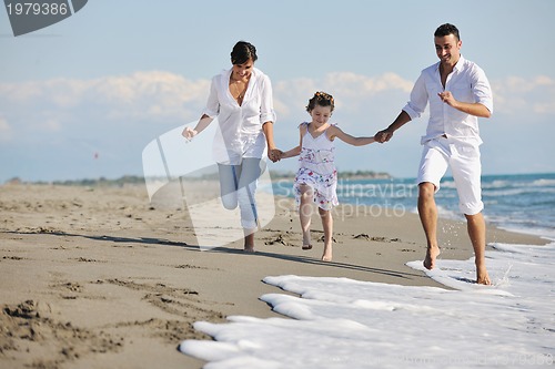Image of happy young  family have fun on beach
