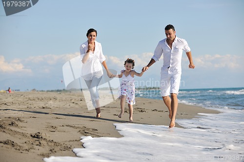 Image of happy young  family have fun on beach
