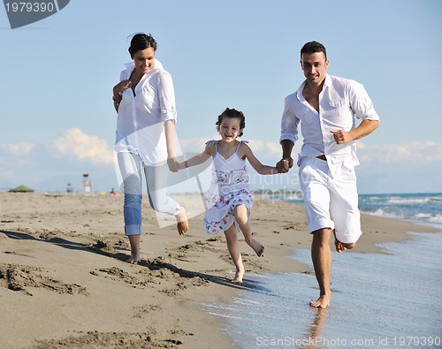 Image of happy young  family have fun on beach