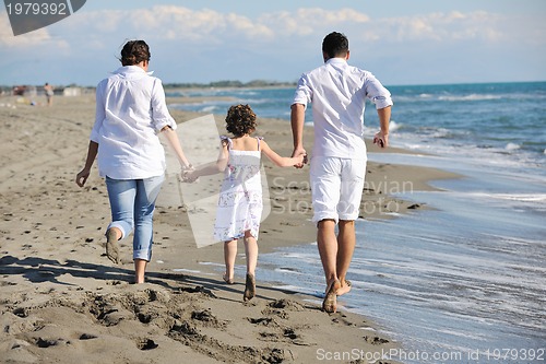Image of happy young  family have fun on beach