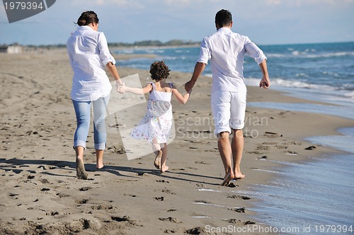 Image of happy young  family have fun on beach
