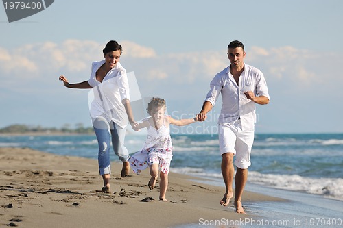 Image of happy young  family have fun on beach