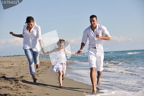 Image of happy young  family have fun on beach