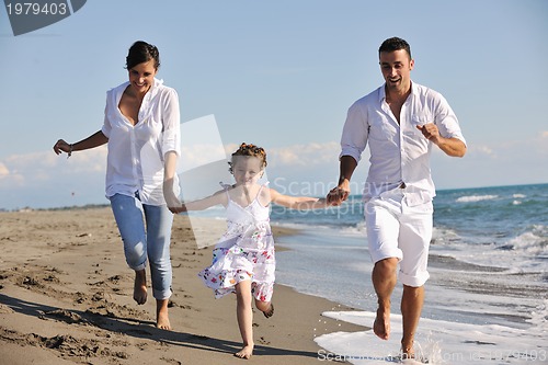 Image of happy young  family have fun on beach