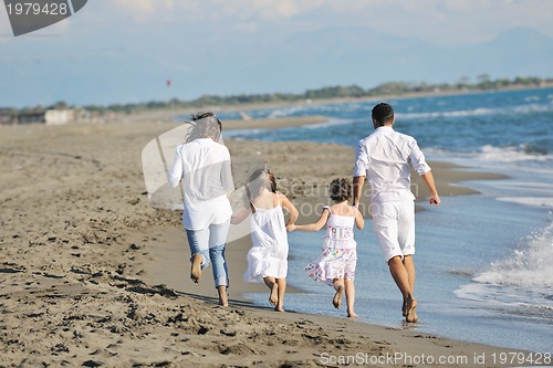 Image of happy young  family have fun on beach
