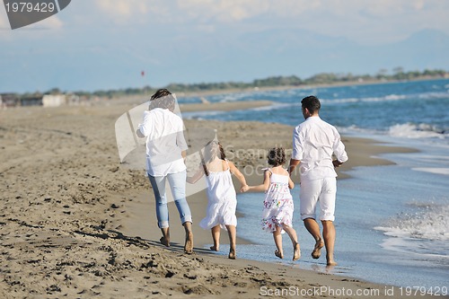 Image of happy young  family have fun on beach