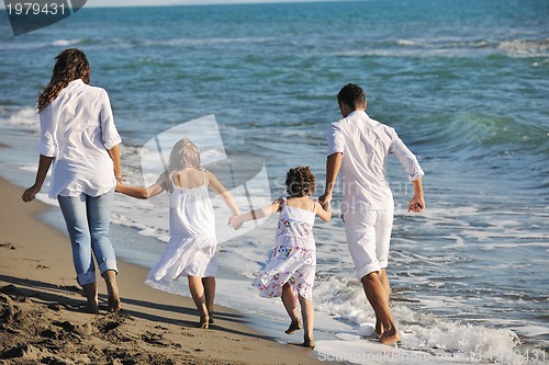 Image of happy young  family have fun on beach