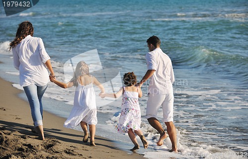 Image of happy young  family have fun on beach