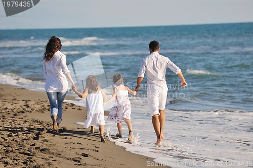 Image of happy young  family have fun on beach