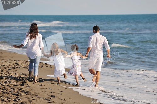 Image of happy young  family have fun on beach