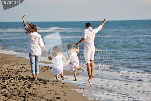 Image of happy young  family have fun on beach