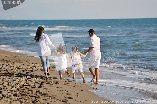 Image of happy young  family have fun on beach