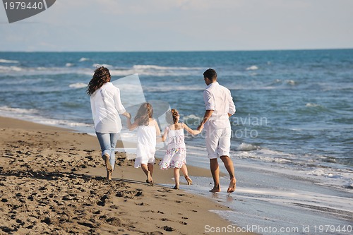 Image of happy young  family have fun on beach