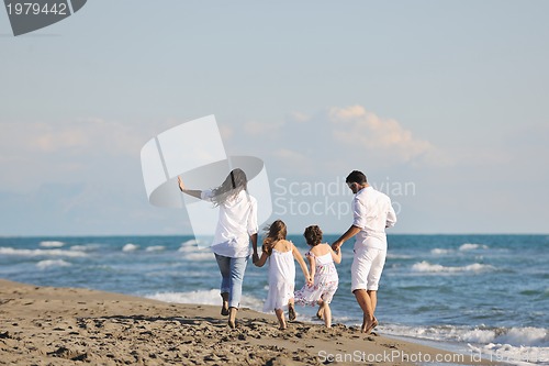 Image of happy young  family have fun on beach