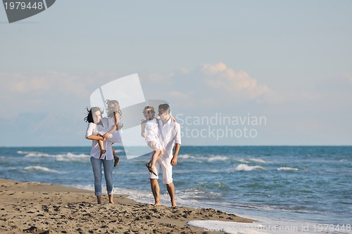 Image of happy young  family have fun on beach