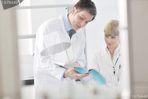 Image of science people in bright lab