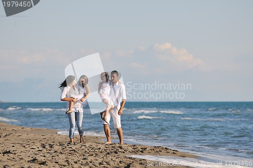Image of happy young  family have fun on beach