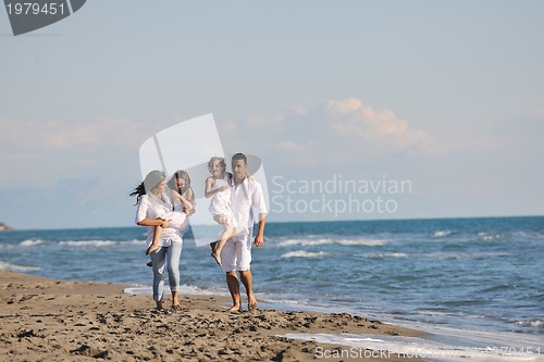Image of happy young  family have fun on beach