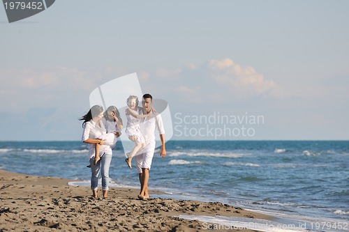 Image of happy young  family have fun on beach
