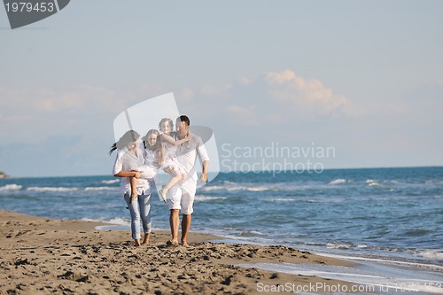 Image of happy young  family have fun on beach