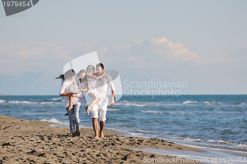 Image of happy young  family have fun on beach