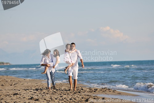 Image of happy young  family have fun on beach