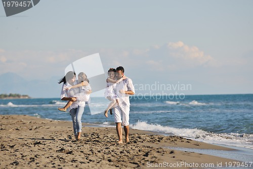 Image of happy young  family have fun on beach