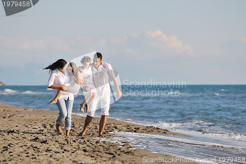 Image of happy young  family have fun on beach