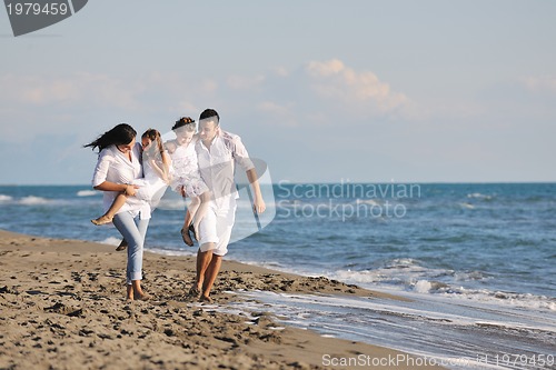 Image of happy young  family have fun on beach