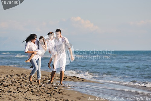 Image of happy young  family have fun on beach
