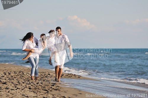 Image of happy young  family have fun on beach