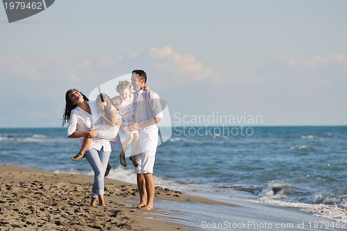 Image of happy young  family have fun on beach