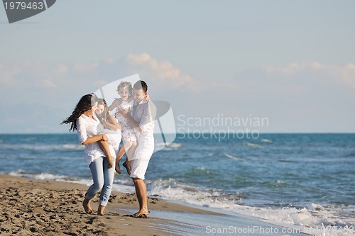 Image of happy young  family have fun on beach