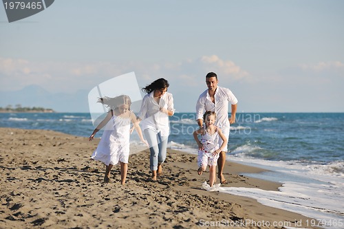 Image of happy young  family have fun on beach