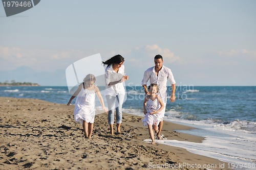 Image of happy young  family have fun on beach