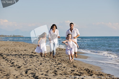 Image of happy young  family have fun on beach