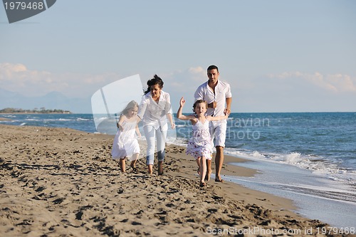 Image of happy young  family have fun on beach