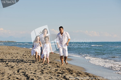 Image of happy young  family have fun on beach