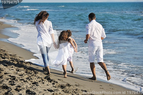 Image of happy young  family have fun on beach