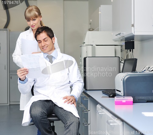 Image of science people in bright lab